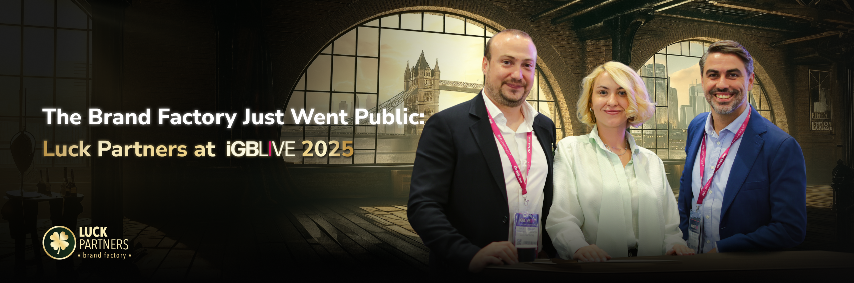Linos Tombulidis, Catherine Watts, and André Cardoso of Luck Partners at iGB L!VE 2025 in London, standing in front of a stylized Tower Bridge backdrop.